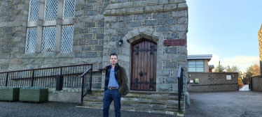 Andrew Bowie outside a Church